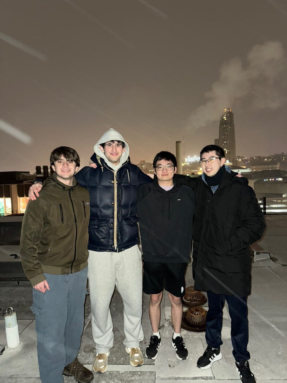Darren with friends on a Pittsburgh rooftop