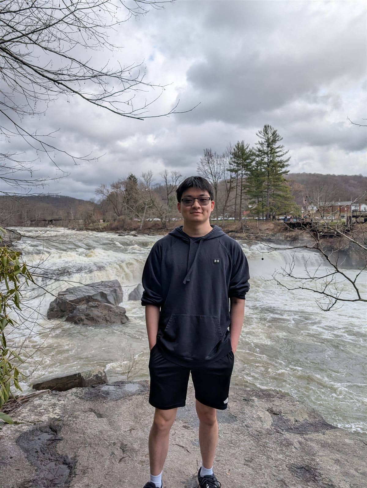 Darren standing near a river overlook